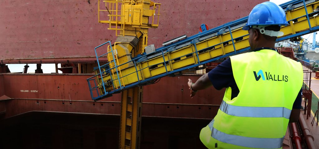 A Vallis worker wearing a Vallis Group high-vis jacket.
