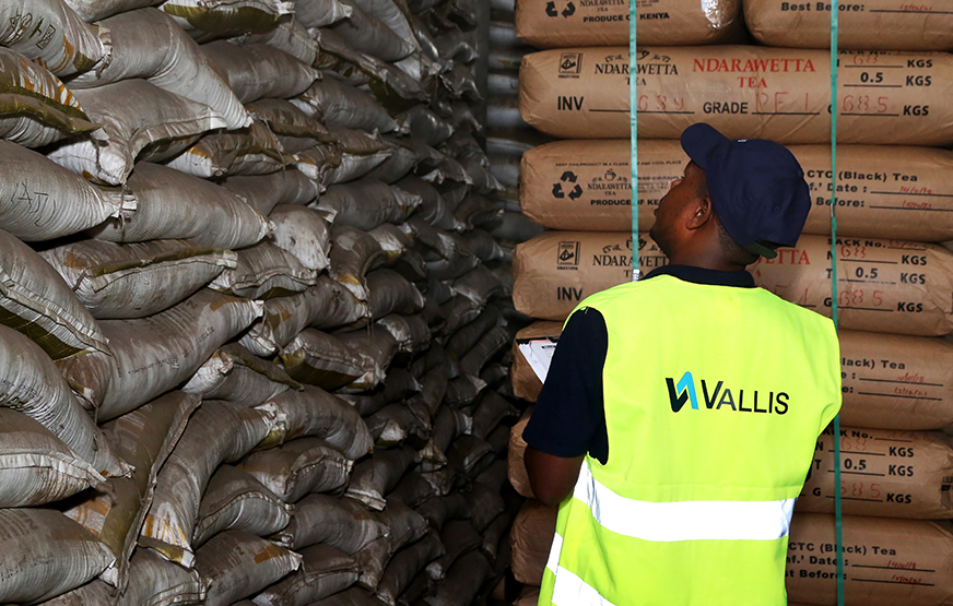 A Vallis worker wearing a Vallis Group high-vis jacket.