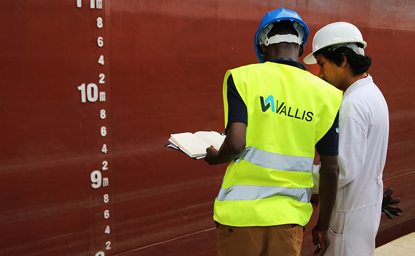 A Vallis worker wearing a Vallis Group high-vis jacket.