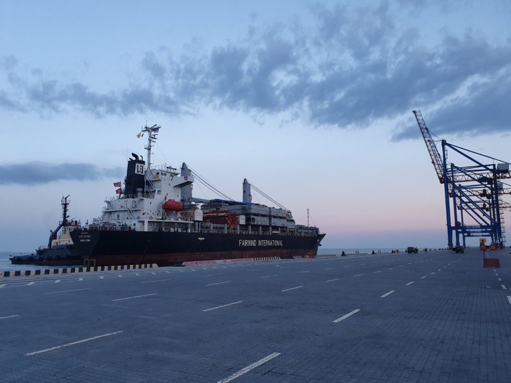 A large ship docked at a port.